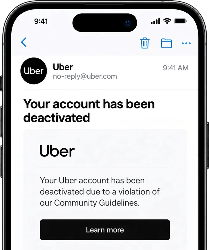A deactivation email from Uber open on a phone
